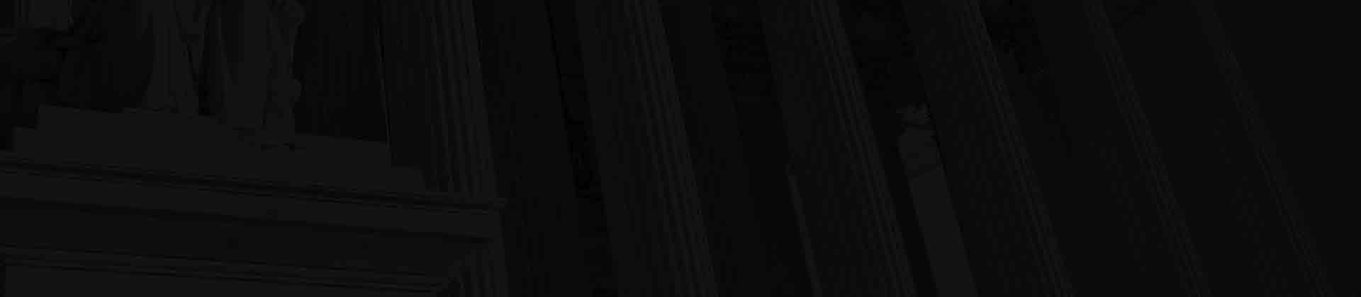 Footer background image of the columns in front of a courthouse.